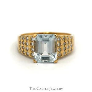 Emerald Cut Aquamarine Ring with Diamond Cluster Sides in 14k Yellow Gold