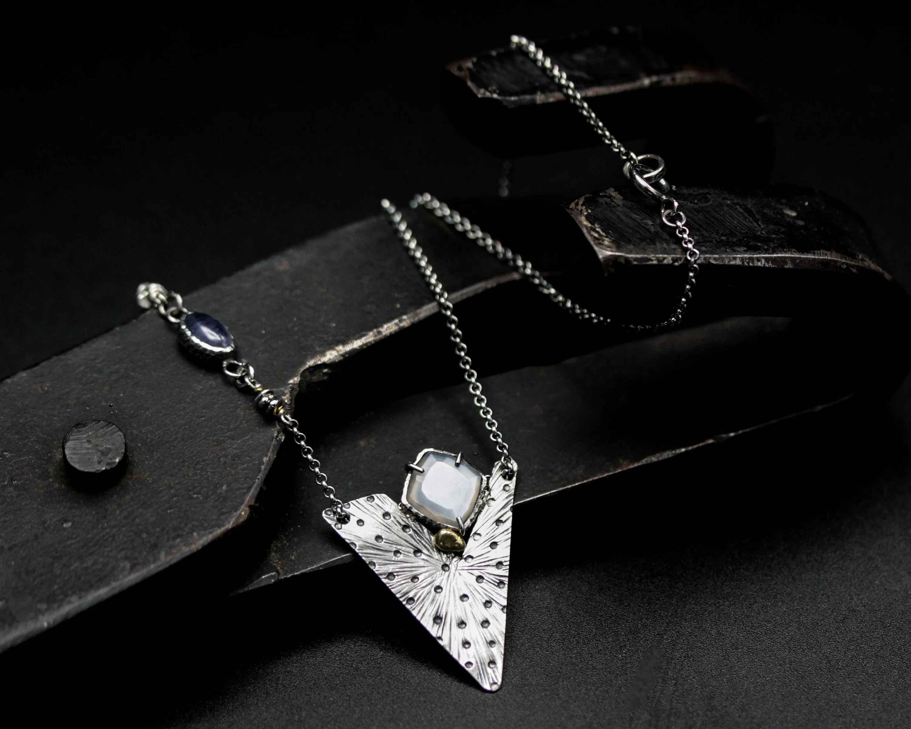 White Moonstone pendant necklace with engraving technique in silver triangle shape on sterling silver chain