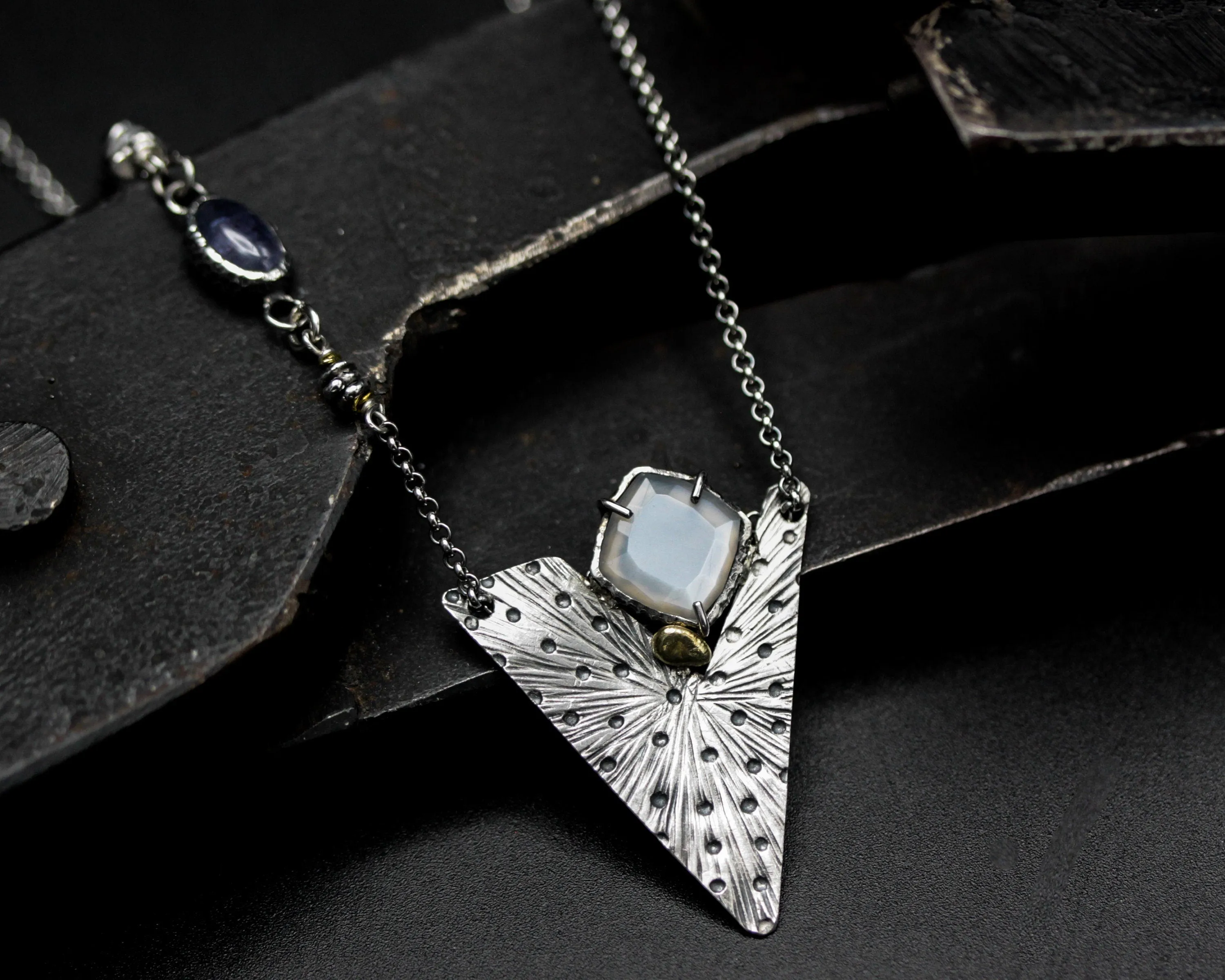 White Moonstone pendant necklace with engraving technique in silver triangle shape on sterling silver chain